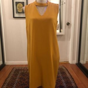 Mustard dress (cutout chest). Knee length. Size small.